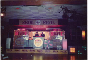 Vintage picture of DJs behind their booth